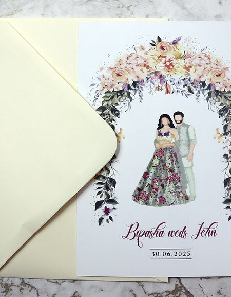 Indian Couple Standing beneath floral arch shadi card .com