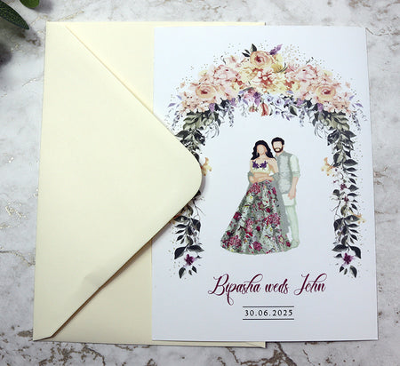 Indian Couple Standing beneath floral arch shadi card .com