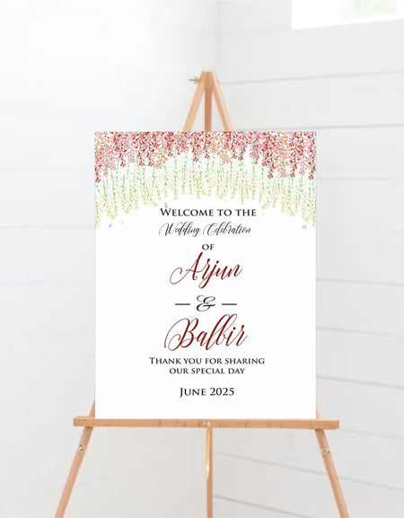 Floral wedding welcome sign with red, pink, and green hanging flowers on an A1 foam board