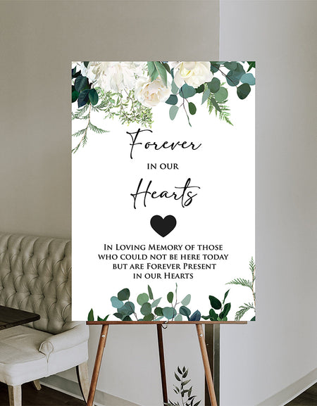 Front view of 2055 In Loving Memory Sign Poster Board, showcasing ivory and white flowers with green leaves at the top and bottom, creating a serene and elegant design