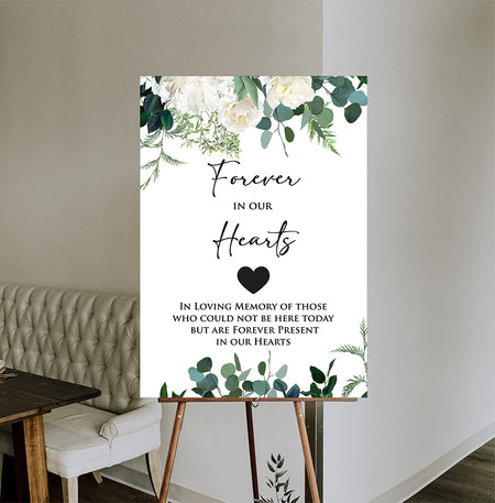 Front view of 2055 In Loving Memory Sign Poster Board, showcasing ivory and white flowers with green leaves at the top and bottom, creating a serene and elegant design