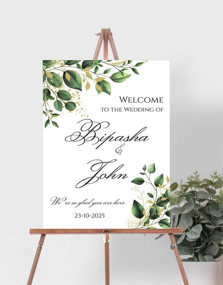 Botanical-themed wedding entrance sign with leaf design in top left and bottom right corners by shaadi cards