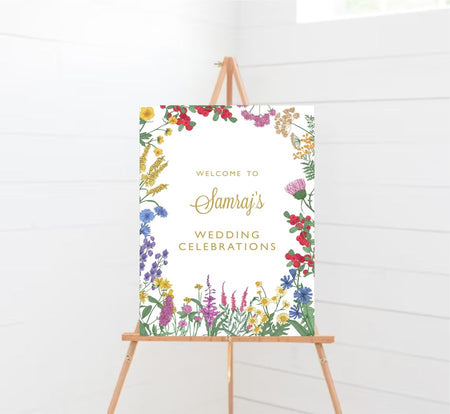 Floral-themed wedding welcome board in portrait layout with bright watercolor flowers from Shadi card.com
