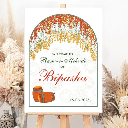 Custom wedding entrance sign with colorful floral accents and traditional dholkis