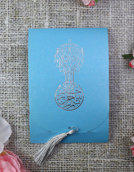 Front view of ABC 539 Blue Silver Bismillah Invitation, showcasing shimmering blue cardstock with silver foiled Arabic calligraphy and a decorative silver tassel, creating a luxurious and elegant design