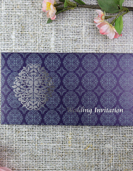 Front view of ABC 671 Arabesque Design Wedding Invitation, showcasing a light and dark blue patterned cardstock with an enlarged Arabesque design letterpress foiled in silver, creating a luxurious and elegant look.