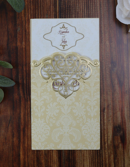 Front on view of the Ivory and Gold Pocket Lasercut Wedding invitation with Damask pattern design