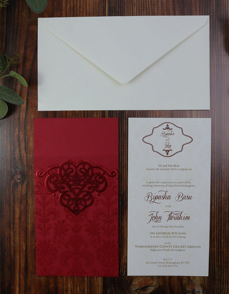 Flat lay view of laser cut invitation in Royal Red with gorgeous foiled accent