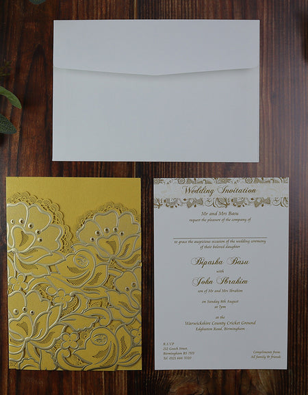 Flat-lay of the Gold Rose Laser Cut Pocket Invitation, showcasing the intricate laser-cut floral design and elegant craftsmanship.