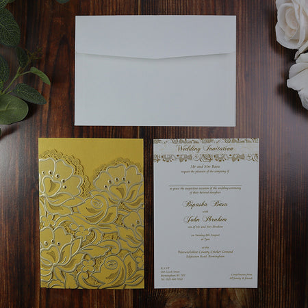 Flat-lay of the Gold Rose Laser Cut Pocket Invitation, showcasing the intricate laser-cut floral design and elegant craftsmanship.