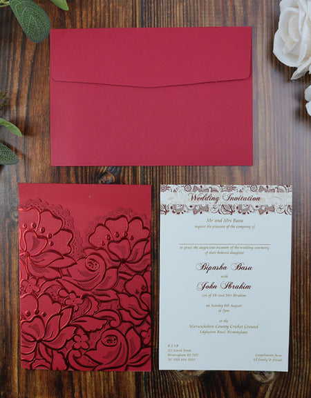 Flat-lay of the red laser-cut pocket invitation, showcasing the luxurious floral design and high-quality craftsmanship.