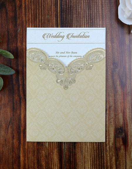 Front view of the Ivory Damask Laser cut pocket invitation with Gold foiled paisley Design