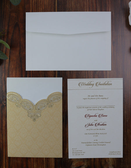 Open view of all the inserts of the wedding program for this elegant pocket invitation featuring a delicate laser cut invitation design in ivory and gold