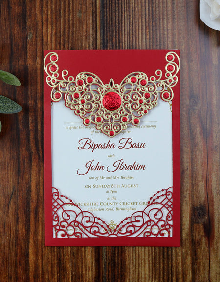 Open view of the Majestic Red and Gold Laser Cut Wedding Invitation, displaying the pocket for additional inserts and fine craftsmanship.