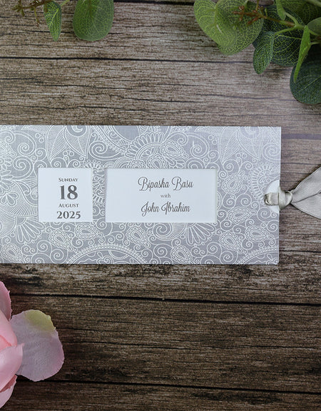 Front view of the RWB Silver Pocket Invitation, showcasing the elegant paisley embossed pattern and customizable windows.