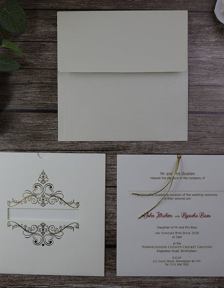 Gold foiled letterpressed accents on this square ivory pocket invte comes with gold twine