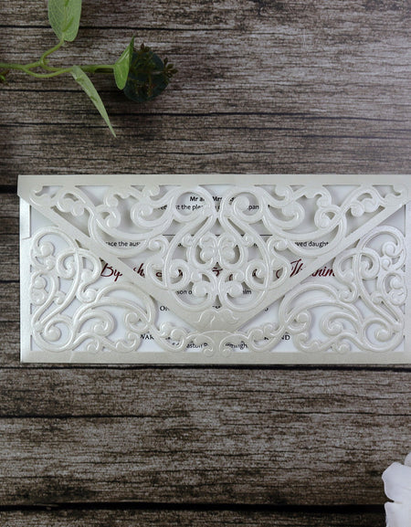 Front view of the pocket filigree design laser cut invitation in white / ivory with shimmer cardstock