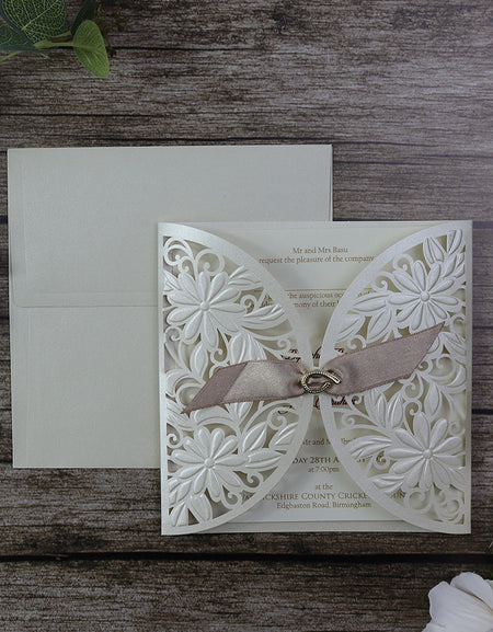 Lasercut pocket pearlescent shimmer cardstock with ribbon