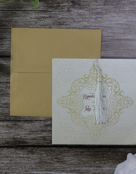Elegant Velvet Embossed Ivory Pocket Wedding Invitation SC 2789 with gold foil accents and ornate window showcasing a personalised insert.