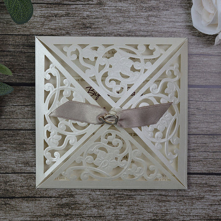 Closed view of SC 5448 Lasercut Square Pocket Invitation, showcasing the shimmering pearlescent cardstock and intricate lasercut design, creating a luxurious and elegant look.