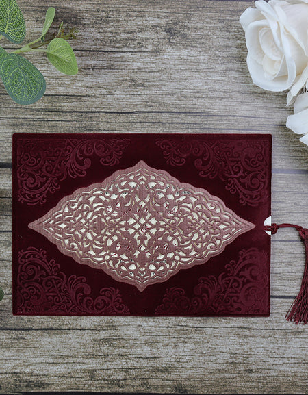 Regal Red Velvet Wedding Invitation SC 5568 with laser-cut front and debossed corner design, featuring a tassel attachment