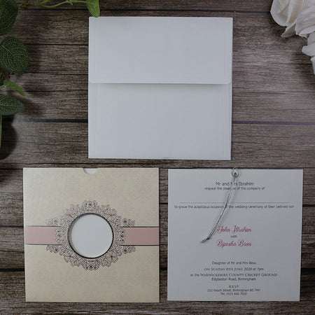 Open view of SC 5657 Invitation, revealing the pocket design with an insert visible through the circular cutout window, secured with a silver twine for a luxurious touch from Shaadi Card