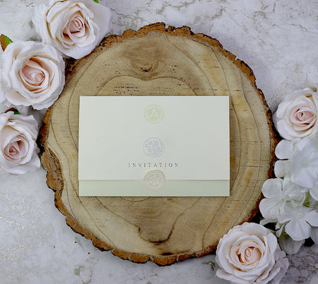 Green tri-fold wedding invitation with embossed pastel floral circles