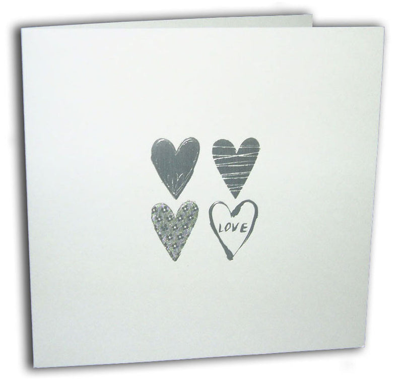 Close-up of the silver letterpress foiled hearts on 5068 Invitation, adding a luxurious touch to this cheap wedding stationery option