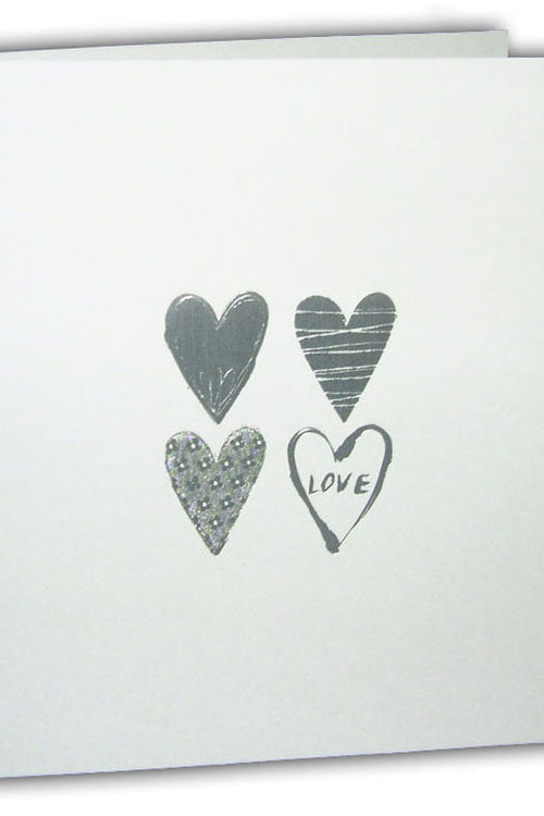 Load image into Gallery viewer, Close-up of the silver letterpress foiled hearts on 5068 Invitation, adding a luxurious touch to this cheap wedding stationery option
