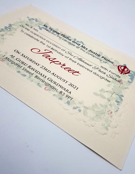 close up of the Punjabi Sikh Bhog Shri Akhand Path invitation in ivory with embossed border