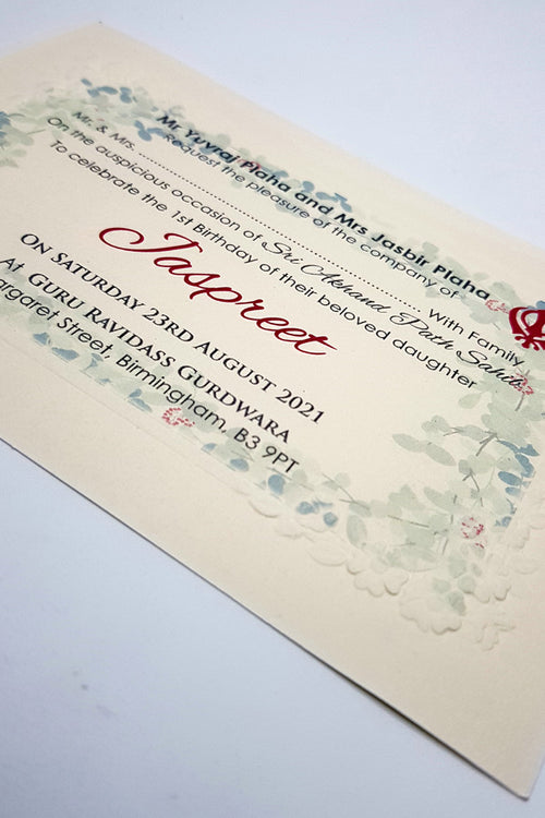 Load image into Gallery viewer, close up of the Punjabi Sikh Bhog Shri Akhand Path invitation in ivory with embossed border
