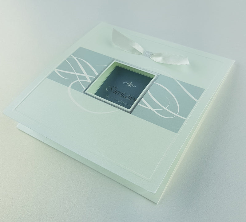 Stacked view of 7006 Invitations, showcasing the square 2-fold design, shimmering pearlescent cardstock, and white ribbon accents, creating a luxurious and modern aesthetic