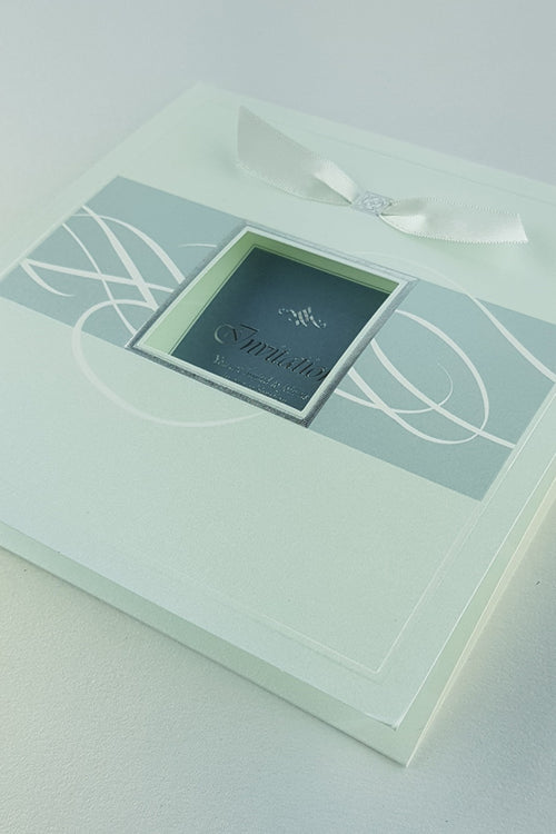 Load image into Gallery viewer, Stacked view of 7006 Invitations, showcasing the square 2-fold design, shimmering pearlescent cardstock, and white ribbon accents, creating a luxurious and modern aesthetic
