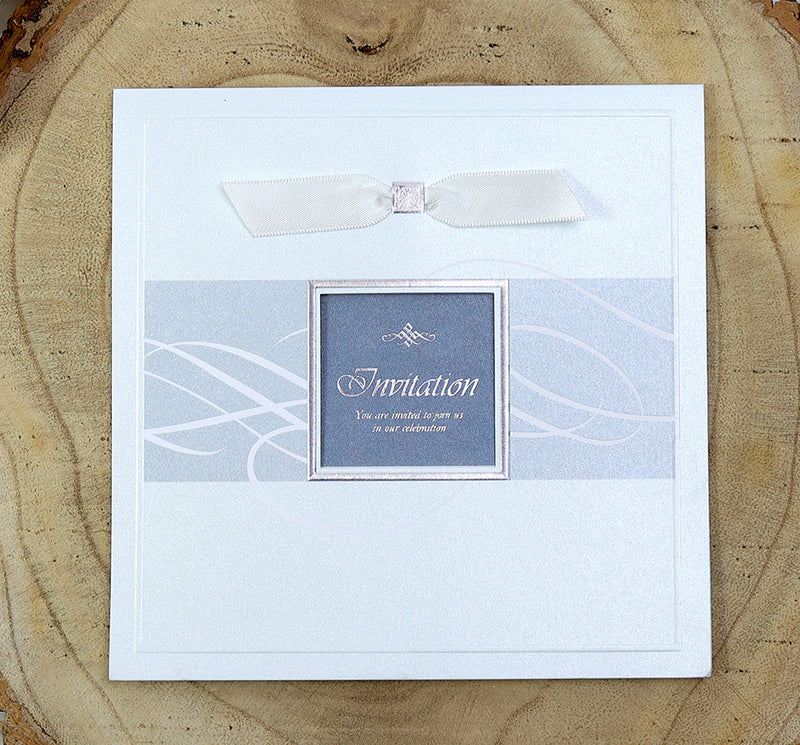7006 Light Blue Accent Silver Invitation displayed with its matching envelope, featuring shimmering pearlescent cardstock and a white ribbon for a cohesive and elegant stationery set