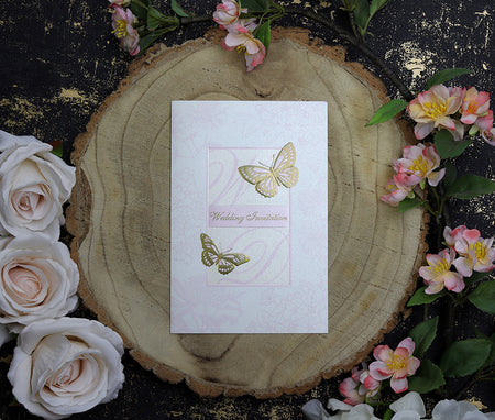 Front view of 7123 Portrait Holographic Foiled & Embossed Wedding Invitation, showcasing two delicate butterflies and a light pink background, creating a romantic and luxurious look.
