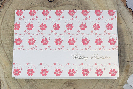 Single fold pearlescent shimmer wedding card with pink garland design