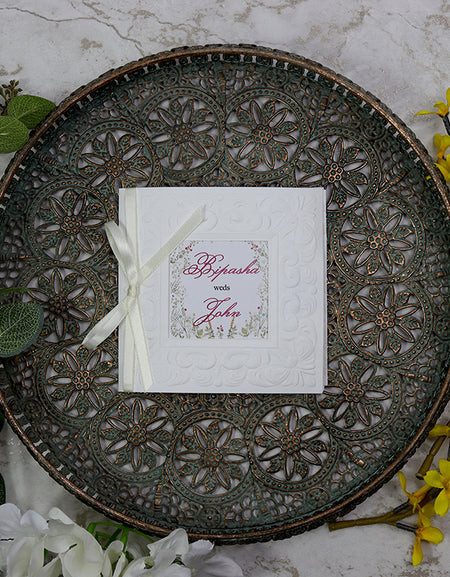 Close-up of 8701 wedding invitation highlighting the customisable square window cutout and embossed border. from Parekhcards.com