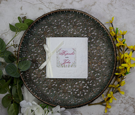Close-up of 8701 wedding invitation highlighting the customisable square window cutout and embossed border. from Parekhcards.com