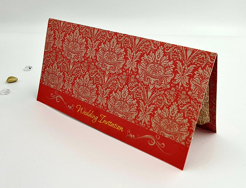 Front view of ABC 443 Traditional Damask Red Wedding Invitation, showcasing a red damask pattern with gold letterpressed 'Wedding Invitation' text at the bottom center