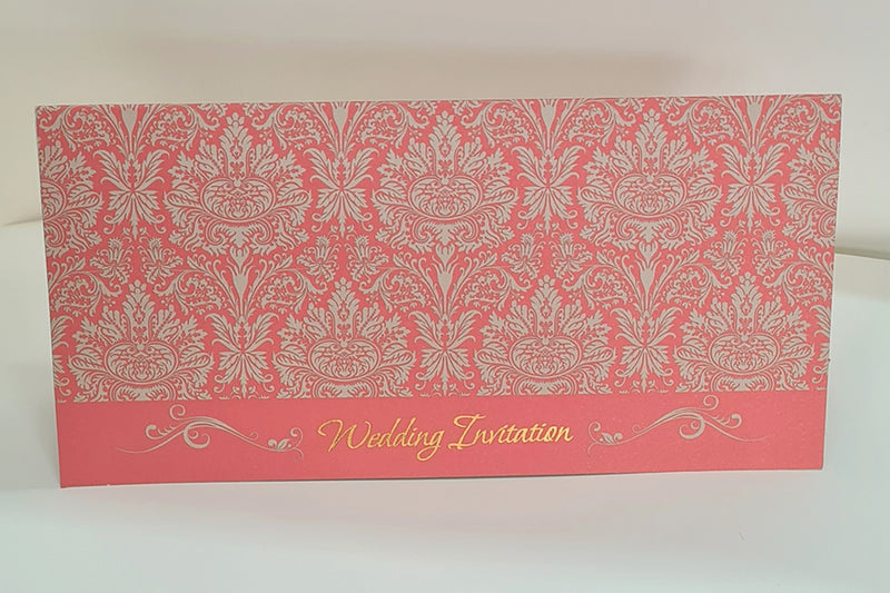ABC 443 Traditional Damask Red Wedding Invitation displayed with its matching envelope, featuring a red damask pattern and gold letterpressed text for a cohesive and elegant stationery set