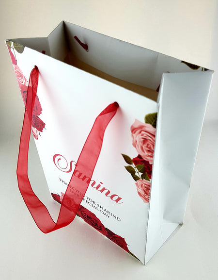 Side angle of the custom floral wedding gift bag, showcasing its sturdy design and premium-quality cardstock material from shadicards.com
