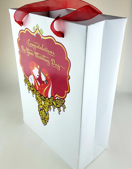 Side angle showcasing high-quality finish, gold detailing, and sheer red ribbon handle