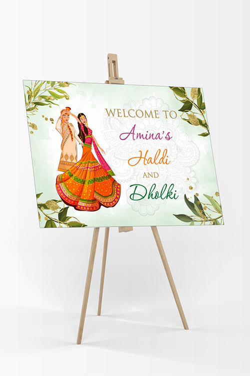 Load image into Gallery viewer, welcome board for haldi ceremony with green leaves and caricaure of Indian bride &amp; groom
