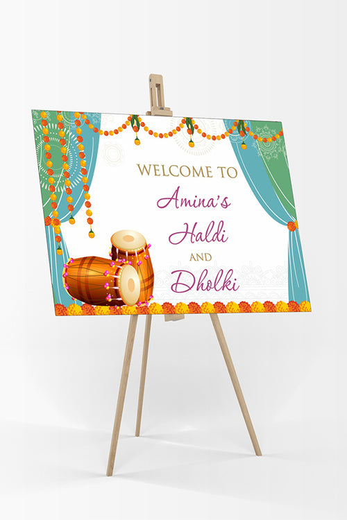 Load image into Gallery viewer, Welcome Board Sign Poster in Orange and Yellow Garlands with Green &amp; sky blue design with 2 dolkhis for Dholki, Henna and haldi parties
