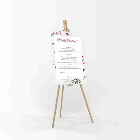 Side-on view of the funny marriage contract for husband with a floral pink and green design