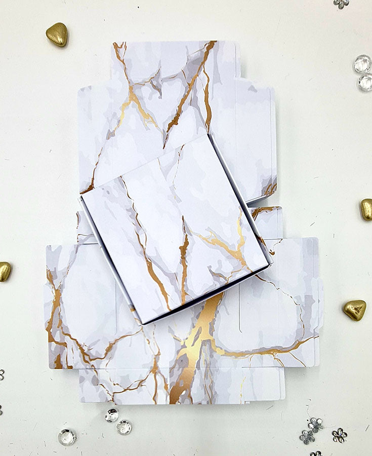 Flat Packed wedding favor boxes in gold and gray marble design