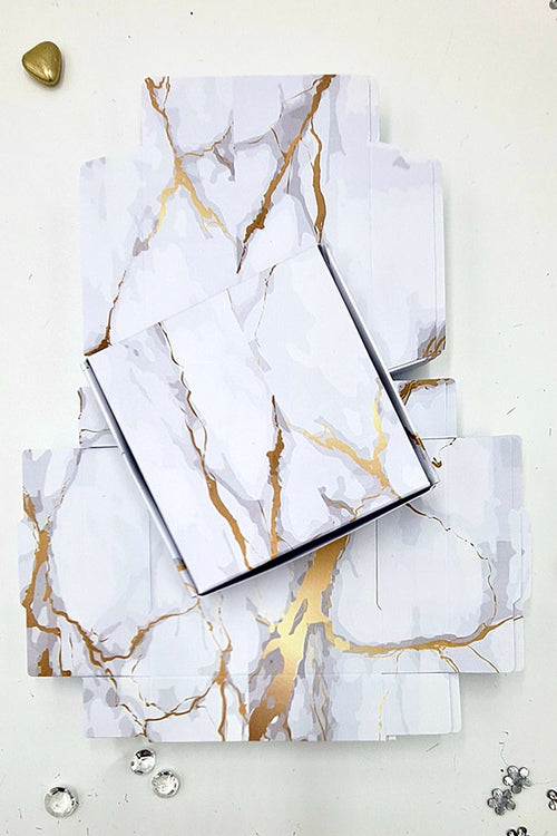 Load image into Gallery viewer, Flat Packed wedding favor boxes in gold and gray marble design
