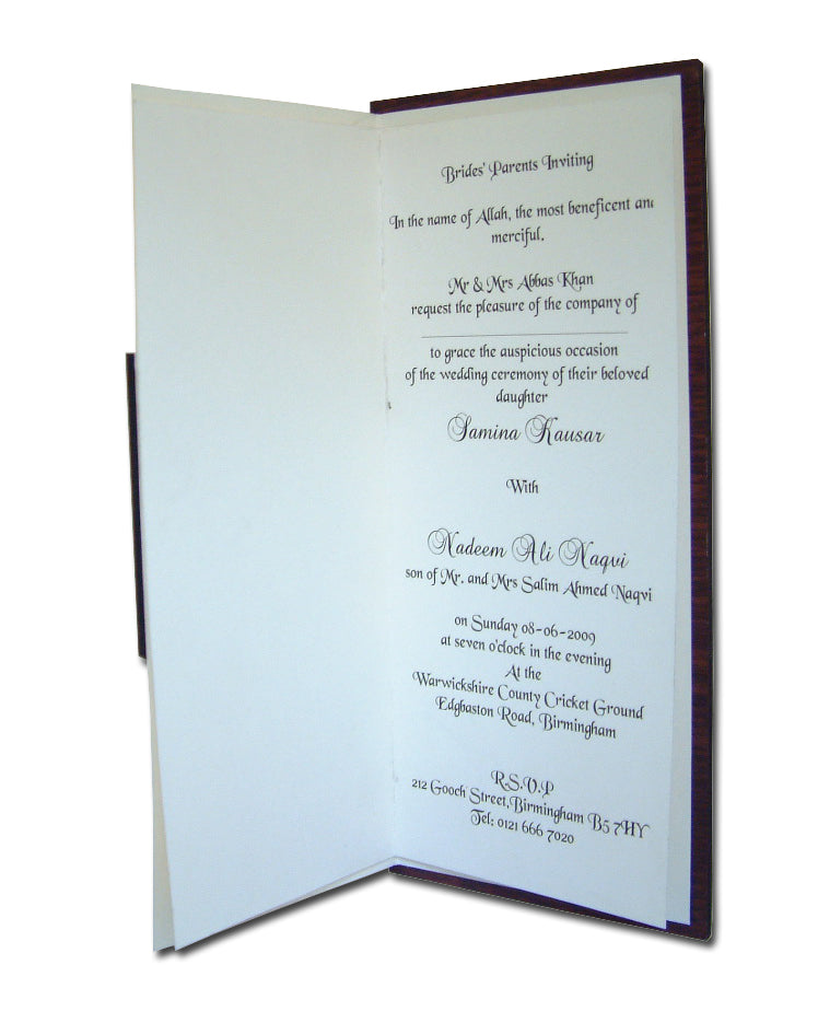 Close-up of the brown wooden texture on WN075 Invitation, showcasing the natural grain and handcrafted details of the ivy leaf carving from Shaadi cards.com